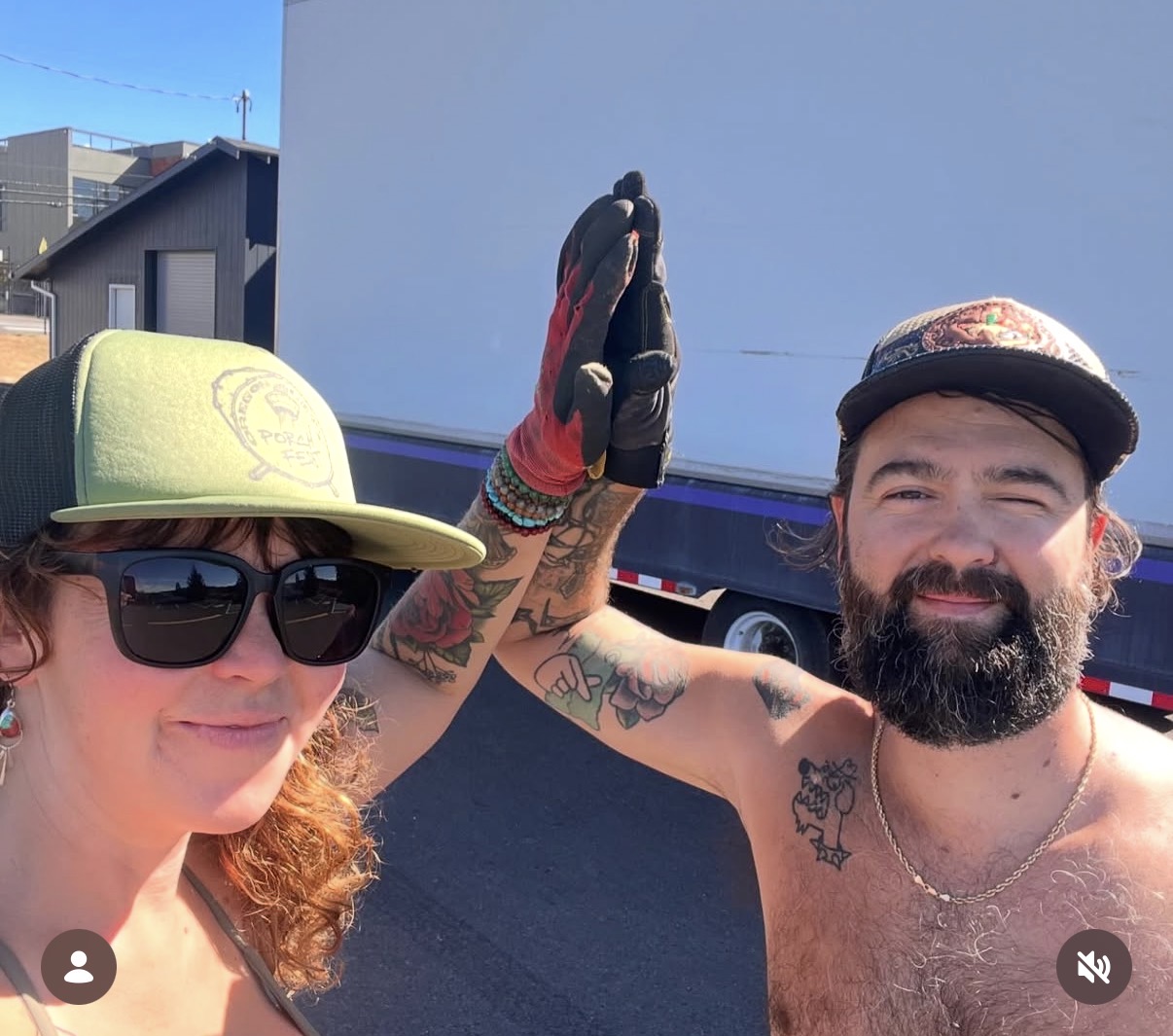 Two Porchfest attendees high-fiving at the festival